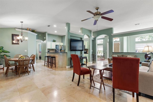 5 Senora Ct, Palm Coast, FL 32164 - dining area with arched walkways, a ceiling fan, healthy amount of natural light, recessed lighting, and a chandelier