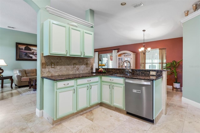 5 Senora Ct, Palm Coast, FL 32164 - kitchen featuring dishwasher, a peninsula, a chandelier, decorative backsplash, and dark stone counters