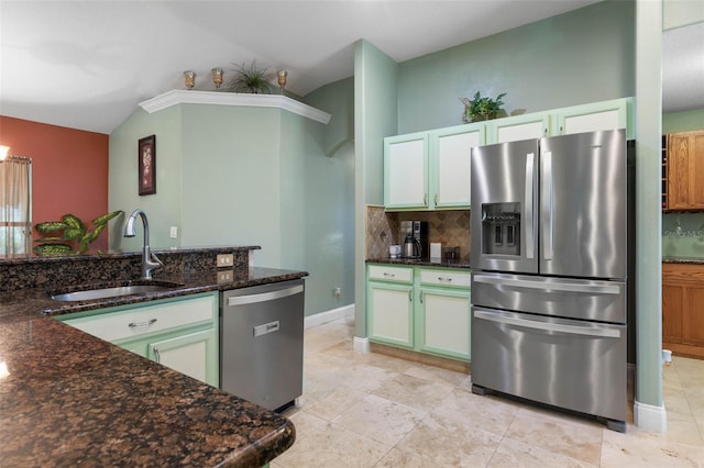 5 Senora Ct, Palm Coast, FL 32164 - kitchen with appliances with stainless steel finishes, lofted ceiling, decorative backsplash, dark stone countertops, and light tile patterned flooring