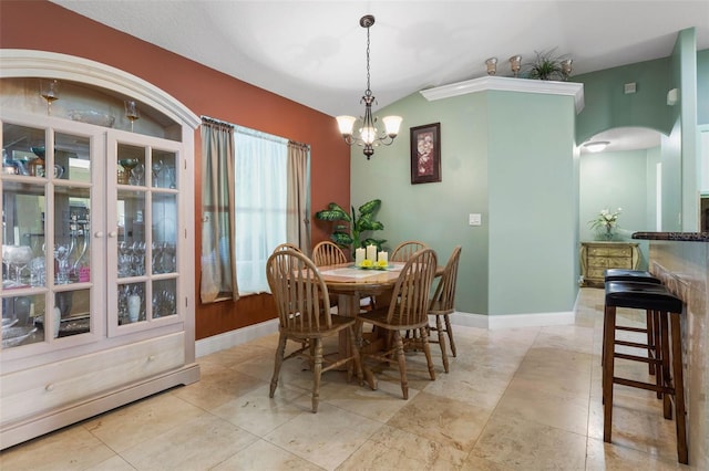 5 Senora Ct, Palm Coast, FL 32164 - dining room with a baseboard heating unit, arched walkways, and a chandelier