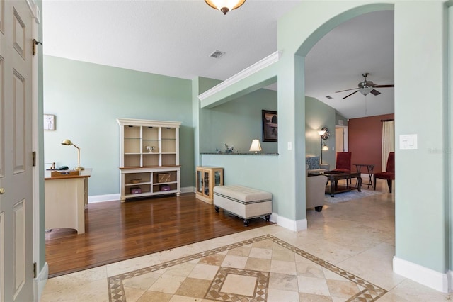 5 Senora Ct, Palm Coast, FL 32164 - living area with inlaid floor details, a ceiling fan, and arched walkways