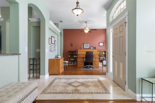 5 Senora Ct, Palm Coast, FL 32164 - entryway featuring ceiling fan, inlaid floor details, and arched walkways
