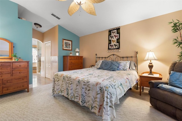 5 Senora Ct, Palm Coast, FL 32164 - bedroom with lofted ceiling, connected bathroom, arched walkways, a closet, and carpet