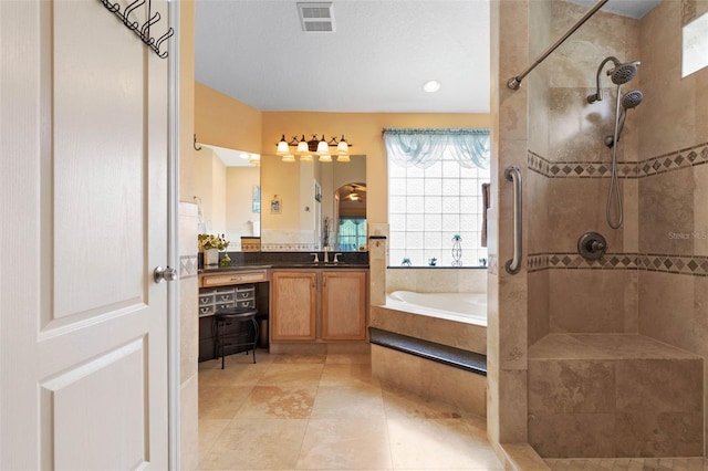 5 Senora Ct, Palm Coast, FL 32164 - bathroom featuring a bath, a tile shower, vanity, and tile patterned floors