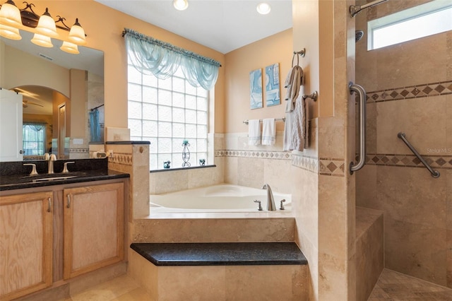 5 Senora Ct, Palm Coast, FL 32164 - bathroom with a garden tub, a tile shower, vanity, tile patterned floors, and recessed lighting