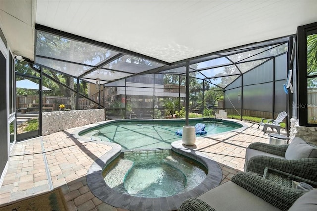 1108 Shockney Dr, Ormond Beach, FL 32174 - view of swimming pool featuring a patio, a pool with connected hot tub, and glass enclosure