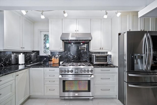 1108 Shockney Dr, Ormond Beach, FL 32174 - kitchen featuring appliances with stainless steel finishes, ventilation hood, rail lighting, and light tile patterned floors