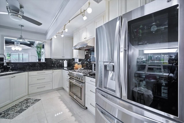 1108 Shockney Dr, Ormond Beach, FL 32174 - kitchen with appliances with stainless steel finishes, under cabinet range hood, ceiling fan, tasteful backsplash, and white cabinetry