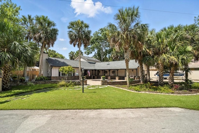 1108 Shockney Dr, Ormond Beach, FL 32174 - rear view of property featuring a yard