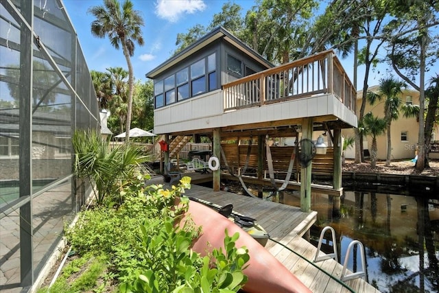 1108 Shockney Dr, Ormond Beach, FL 32174 - dock area featuring a deck and a lanai