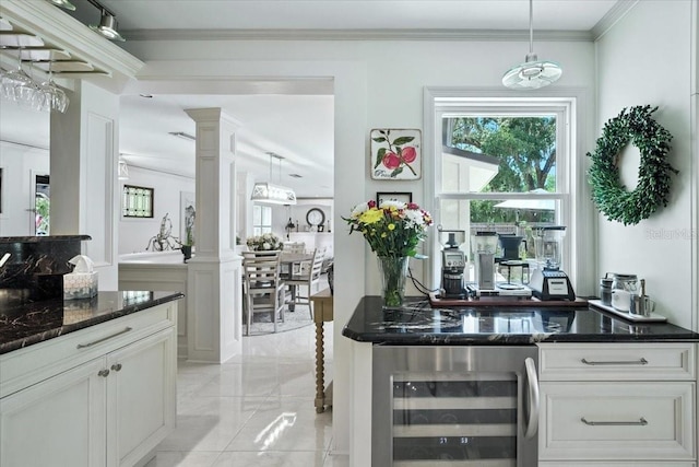 1108 Shockney Dr, Ormond Beach, FL 32174 - bar area with beverage cooler, plenty of natural light, ornate columns, light marble finish flooring, and ornamental molding