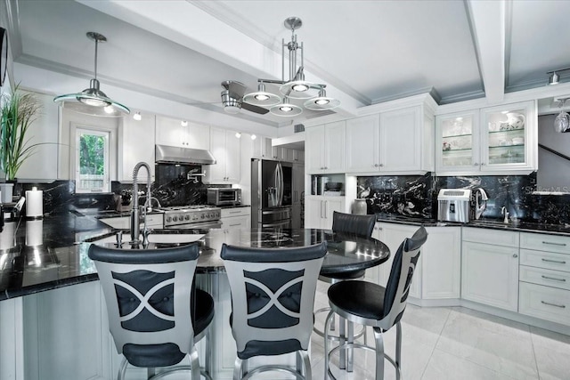 1108 Shockney Dr, Ormond Beach, FL 32174 - kitchen with stainless steel appliances, under cabinet range hood, tasteful backsplash, glass insert cabinets, and beamed ceiling