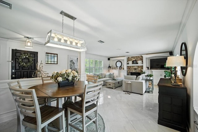 1108 Shockney Dr, Ormond Beach, FL 32174 - dining area featuring crown molding and light marble finish flooring