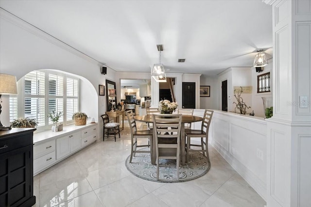 1108 Shockney Dr, Ormond Beach, FL 32174 - dining space featuring ornamental molding