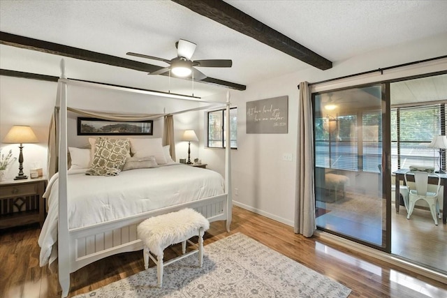 1108 Shockney Dr, Ormond Beach, FL 32174 - bedroom featuring beamed ceiling, wood finished floors, access to outside, and a textured ceiling
