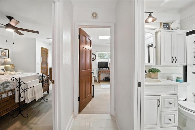 1108 Shockney Dr, Ormond Beach, FL 32174 - ensuite bathroom featuring vanity, a ceiling fan, and ornamental molding