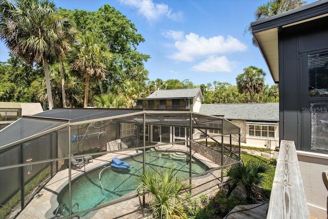 1108 Shockney Dr, Ormond Beach, FL 32174 - outdoor pool featuring a patio and glass enclosure