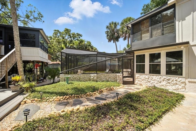 1108 Shockney Dr, Ormond Beach, FL 32174 - view of yard featuring a sunroom and a lanai