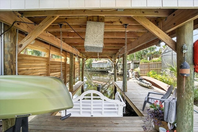 1108 Shockney Dr, Ormond Beach, FL 32174 - wooden deck featuring area for grilling, a boat dock, and boat lift