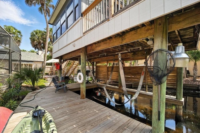 1108 Shockney Dr, Ormond Beach, FL 32174 - dock featuring stairs and glass enclosure