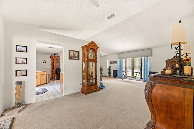 1 Ryberry Pl, Palm Coast, FL 32164 - sitting room featuring light carpet, a textured ceiling, and light tile patterned floors