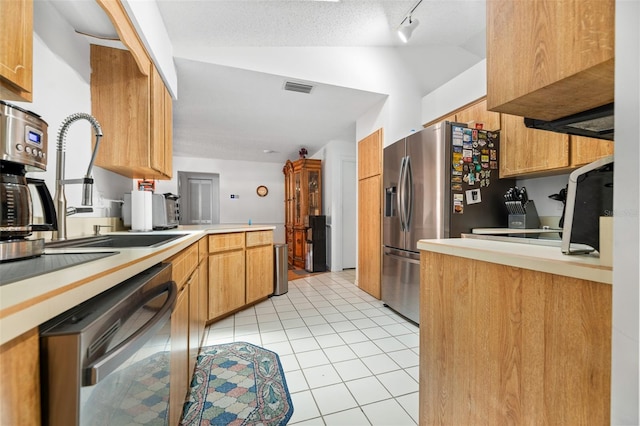 1 Ryberry Pl, Palm Coast, FL 32164 - kitchen with dishwashing machine, vaulted ceiling, light tile patterned floors, a peninsula, and light countertops