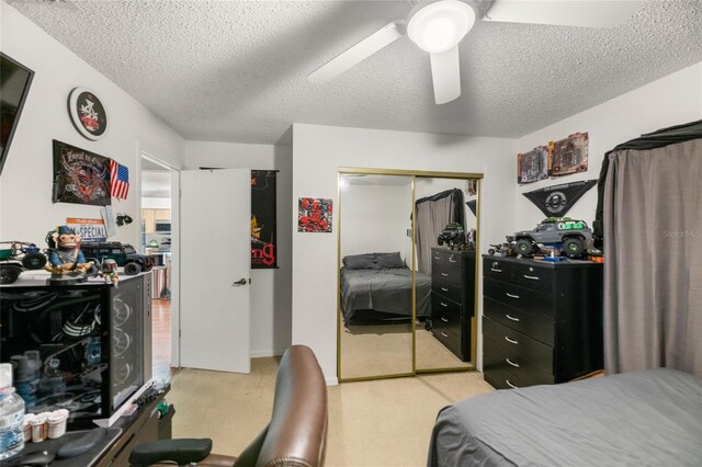 1 Ryberry Pl, Palm Coast, FL 32164 - bedroom with light carpet, a closet, a textured ceiling, and a ceiling fan
