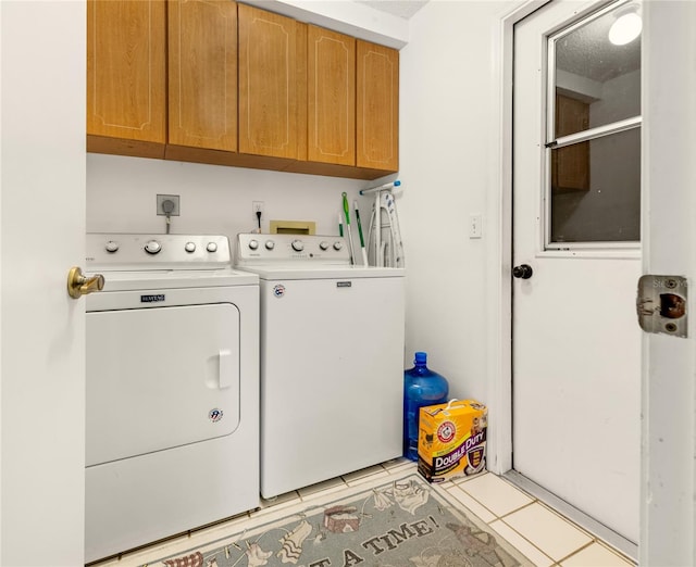 1 Ryberry Pl, Palm Coast, FL 32164 - washroom featuring washing machine and clothes dryer, cabinet space, and light tile patterned floors