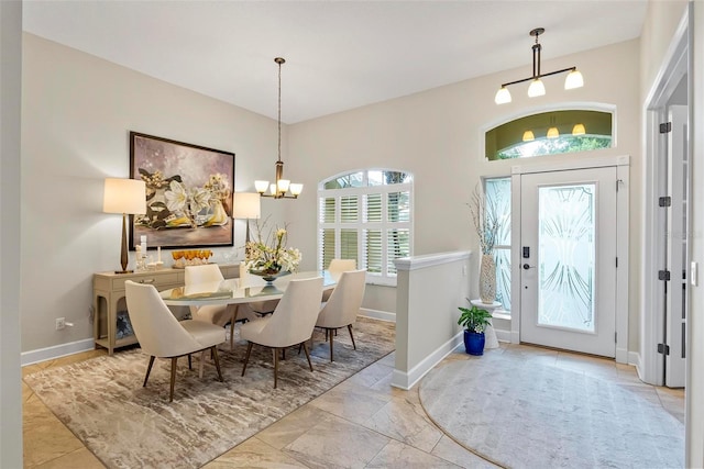 1254 Royal Pointe Ln, Ormond Beach, FL 32174 - dining space featuring a chandelier and baseboards