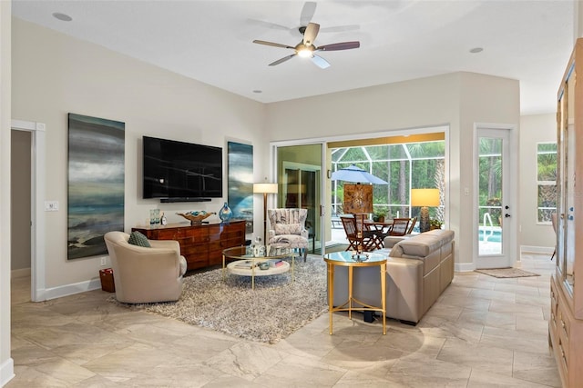 1254 Royal Pointe Ln, Ormond Beach, FL 32174 - living room with a ceiling fan and baseboards