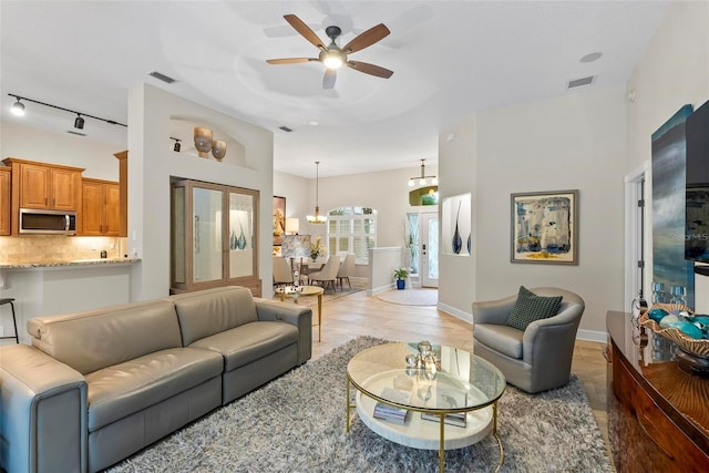 1254 Royal Pointe Ln, Ormond Beach, FL 32174 - living room with a ceiling fan and baseboards