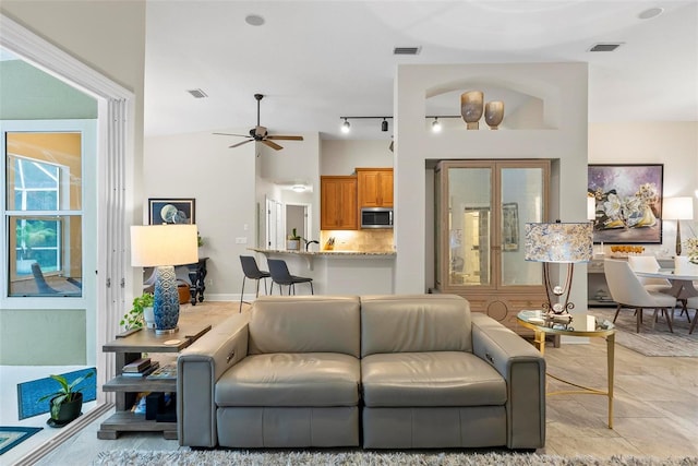 1254 Royal Pointe Ln, Ormond Beach, FL 32174 - living room with a ceiling fan and track lighting