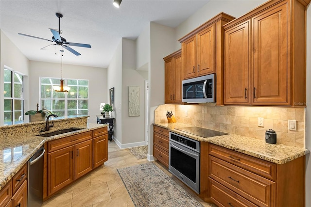 1254 Royal Pointe Ln, Ormond Beach, FL 32174 - kitchen featuring stainless steel appliances, brown cabinets, backsplash, and a ceiling fan
