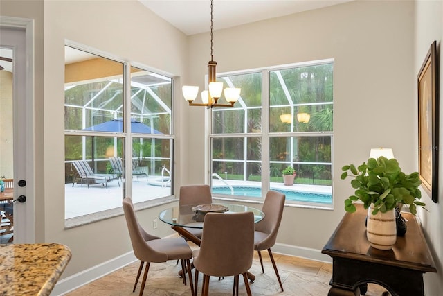 1254 Royal Pointe Ln, Ormond Beach, FL 32174 - dining area with a chandelier and healthy amount of natural light