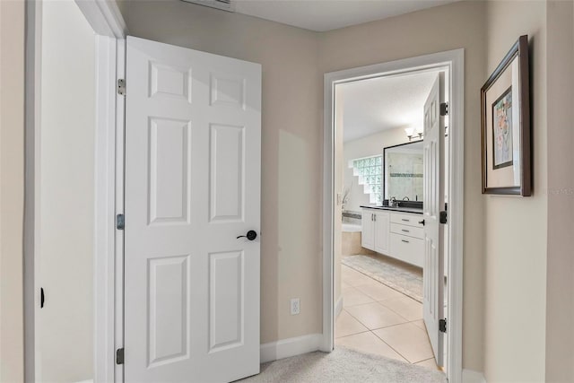 1254 Royal Pointe Ln, Ormond Beach, FL 32174 - hallway featuring light tile patterned flooring and baseboards