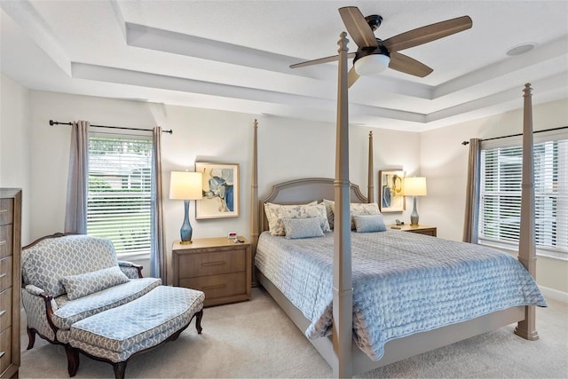 1254 Royal Pointe Ln, Ormond Beach, FL 32174 - bedroom featuring a raised ceiling, light colored carpet, and ceiling fan