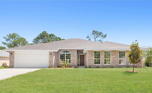 18 Slipper Orchid Trl E, Palm Coast, FL 32164 - ranch-style home featuring an attached garage, a front yard, driveway, and brick siding