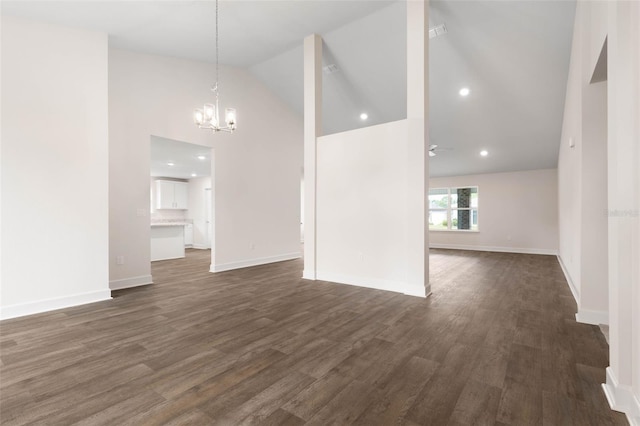 18 Slipper Orchid Trl E, Palm Coast, FL 32164 - unfurnished living room featuring a chandelier, high vaulted ceiling, dark wood-style flooring, and recessed lighting