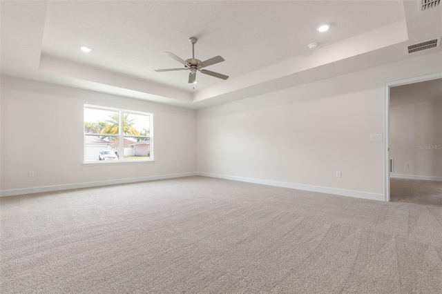 18 Slipper Orchid Trl E, Palm Coast, FL 32164 - empty room with a raised ceiling, light carpet, a ceiling fan, and recessed lighting