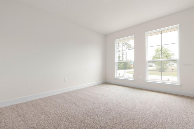 18 Slipper Orchid Trl E, Palm Coast, FL 32164 - empty room with light colored carpet and baseboards