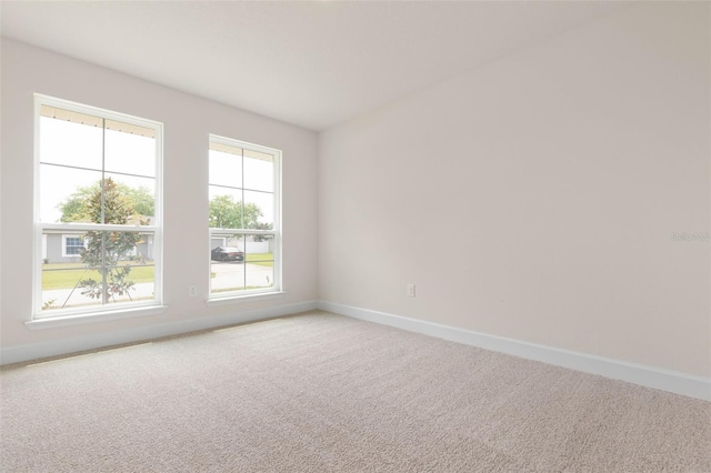 18 Slipper Orchid Trl E, Palm Coast, FL 32164 - unfurnished room featuring baseboards and carpet flooring