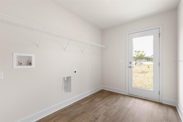 18 Slipper Orchid Trl E, Palm Coast, FL 32164 - washroom with wood finished floors, washer hookup, and electric dryer hookup