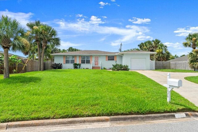1026 Bel Aire Dr, Daytona Beach, FL 32118 - single story home featuring driveway and an attached garage