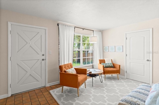1026 Bel Aire Dr, Daytona Beach, FL 32118 - living area featuring baseboards and brick patterned floors