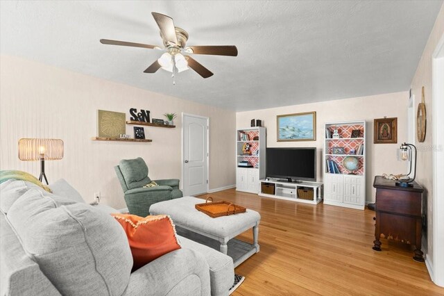 1026 Bel Aire Dr, Daytona Beach, FL 32118 - living area with ceiling fan and light wood-style floors