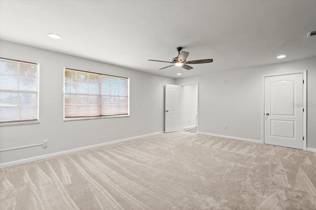 1026 Bel Aire Dr, Daytona Beach, FL 32118 - unfurnished bedroom featuring light colored carpet, recessed lighting, and a ceiling fan