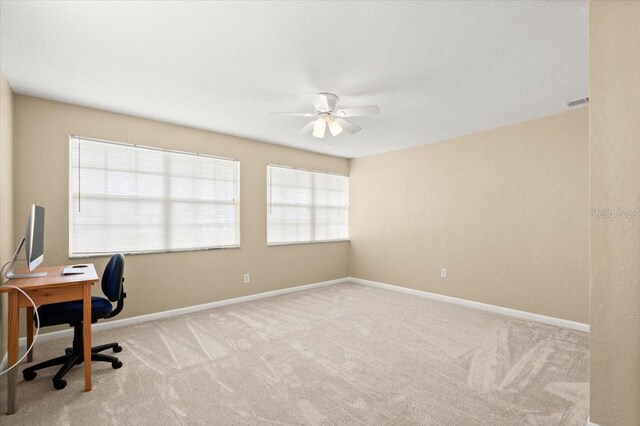 1026 Bel Aire Dr, Daytona Beach, FL 32118 - unfurnished office featuring a ceiling fan and carpet floors