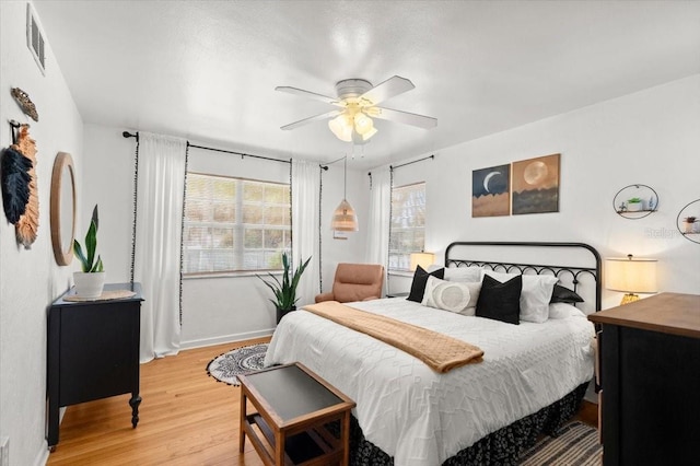 1026 Bel Aire Dr, Daytona Beach, FL 32118 - bedroom with light wood-type flooring and ceiling fan