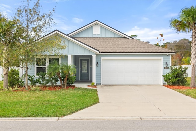392 S Hamilton Springs Rd, Saint Augustine, FL 32084 - view of front of house with a front lawn, board and batten siding, an attached garage, driveway, and a shingled roof
