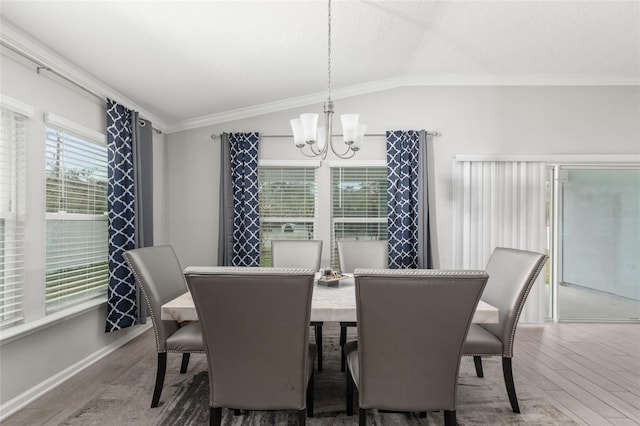 392 S Hamilton Springs Rd, Saint Augustine, FL 32084 - dining space with wood finished floors, a chandelier, crown molding, and lofted ceiling